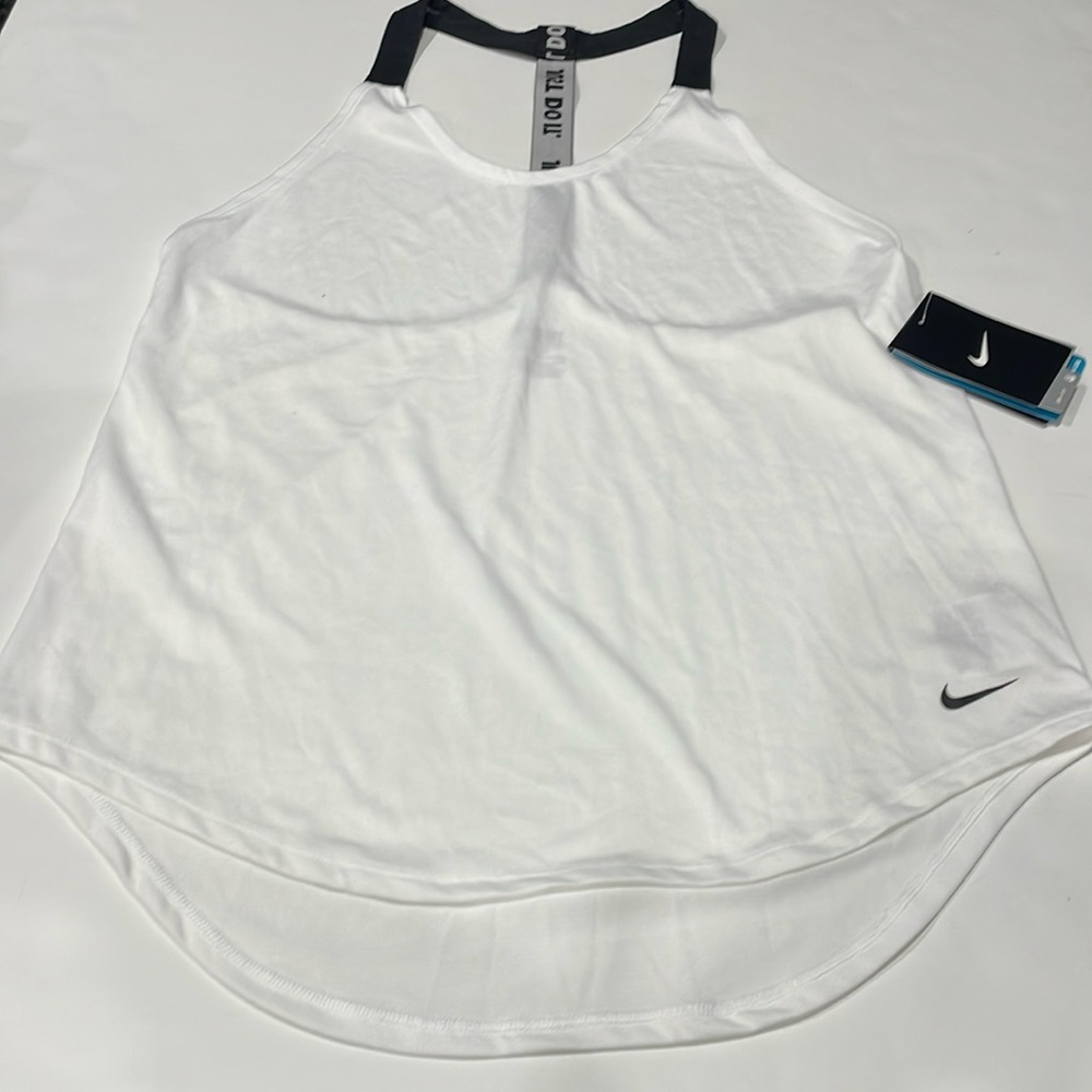 Nike woman’s tank top, size s and band new